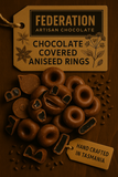 Chocolate covered aniseed rings with 'Federation Artisan Chocolate' label on a dark background