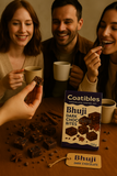 Three friends enjoying Bhuji dark chocolate bites with a box of Coatibles Bhuji dark chocolate bites in the center.