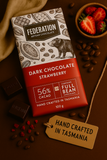 Dark chocolate strawberry bar with 'Federation Artisan Chocolate' packaging on a brown background.